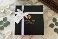 Outside packaging of our magnetic gift box with foil logo, gross grain ribbon and gold foil gift tag 