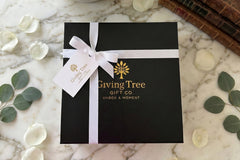 Outside packaging of our magnetic gift box with foil logo, gross grain ribbon and gold foil gift tag 