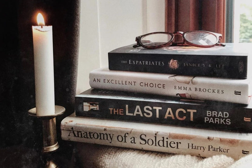 Brown subscription box filled with four historical fiction books, featuring rich narratives and captivating tales set in different eras.