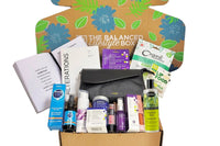 The Balanced Lifestyle Box for women showcases self-care products and a reusable tote bag for wellness journeys