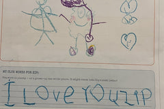 A child's reply to Zip drawn in crayon, with two stick figures, hearts and the words I love you Zip written in big blue letters.