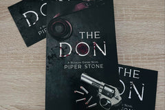 Black cover with a revolver in the bottom right corner. The title The Don appearing in the center. Loose rounds appear next to the revolver.