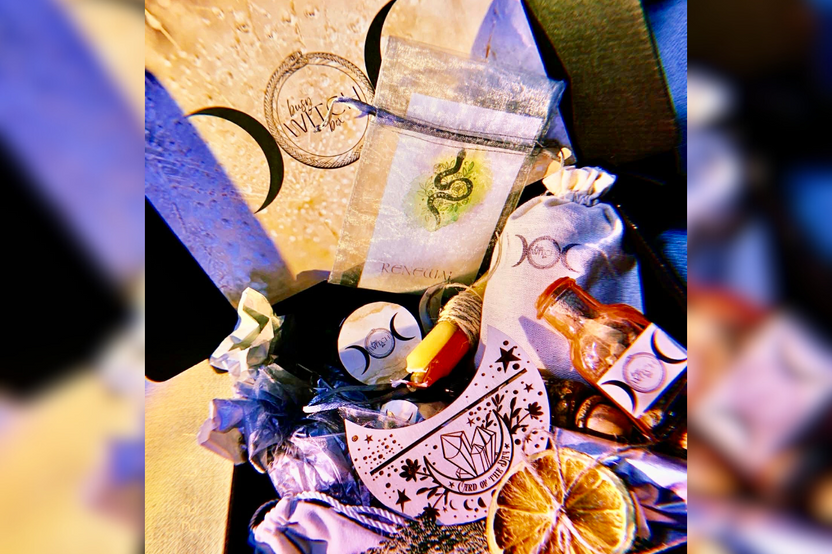 An offering example of Busy Witch Box includes ritual anointing oil, loose incense blend, altar card holder gift, ritual bath blend + more