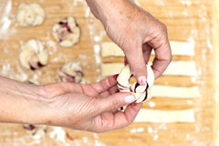 Blueberry Knots at home baking kit featuring vegan braided pastry knots filled with blueberry, perfect for gifting or a fun night in.