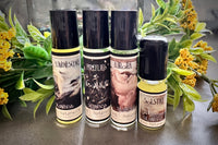 Muse Fragrances by SugarMuses® nestled in a small black box packed with organic moss and other botanicals.