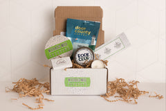 monthly sip + scent subscription box includes one travel-sized candle and one beverage of choice, plus a bookmark and sometimes a sticker.
