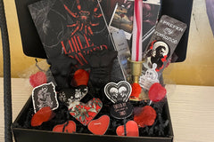 This deliciously dark book box includes a mix of dark romance & Halloween erotic horror books + a themed merch by Gothika Books.
