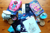 Shows a selection of the gift products we do including sprayed edge book , candle , mug , art print , the jar and notebook and book sleeve.