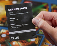 A person holding a black card with this text: can you solve, who, sabotage, clue, what, item was intentionally used.