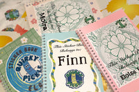 Actual personalized sticker books sent out to subscribers in one of their first packs. Each design has the member's name and an image.