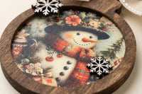Handcrafted vintage-style wooden ornaments featuring art paper designs, finished with rustic details