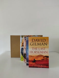 Brown subscription box filled with four young adult light reading books, featuring engaging stories and relatable characters for teen reader