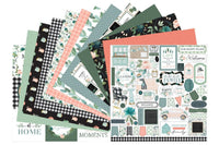 Colorful scrapbook papers and stickers in a monthly scrapbook kit featuring floral designs and cameras, ideal gifts for women