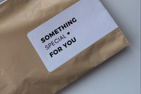 Example of sticker that says “something special for you” with a heart, on the outside of the shipping packaging 