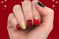 styled nail wraps displaying red, black and gold colors with a variety of patterns, including plaid, solid glitter, and ombre glitter
