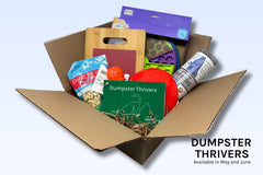 A Dumpster Thrivers Discovery Kit includes two food puzzles, two types of treats, a scratch board, and agility cones.