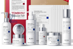 Close up photo of a skin care set from tembusu. With all white colors and with a brown carboard box behind it.