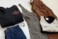 a y2K grunge outfit complete with a romper, zelda t-shirt, vintage denim and jewelry along with natural fabrics like a linen top