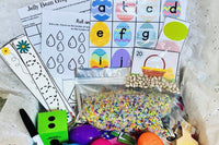Spring themed and raindrop-themed counting and alphabet activities paired with colorful sensory bin filler.