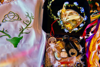 Busy Witch Box featuring a stag altar cloth, floral crown, and ritual oils in a witchcraft subscription box for Sabbat rituals
