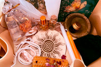 A Litha Sabbat Box with Altar tile, Sun Water, Beeswax, hand poured beeswax, ritual oil, incense blend, ritual candles, ink & quill.