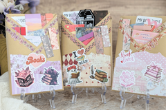 surprise book box with new book, annotation supplies, relaxation and self care items packaged neatly in a box