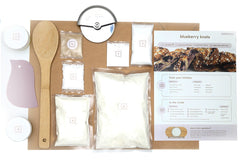 Blueberry Knots baking gift kit featuring vegan braided pastry knots filled with blueberry, perfect for gifting or a fun night in.