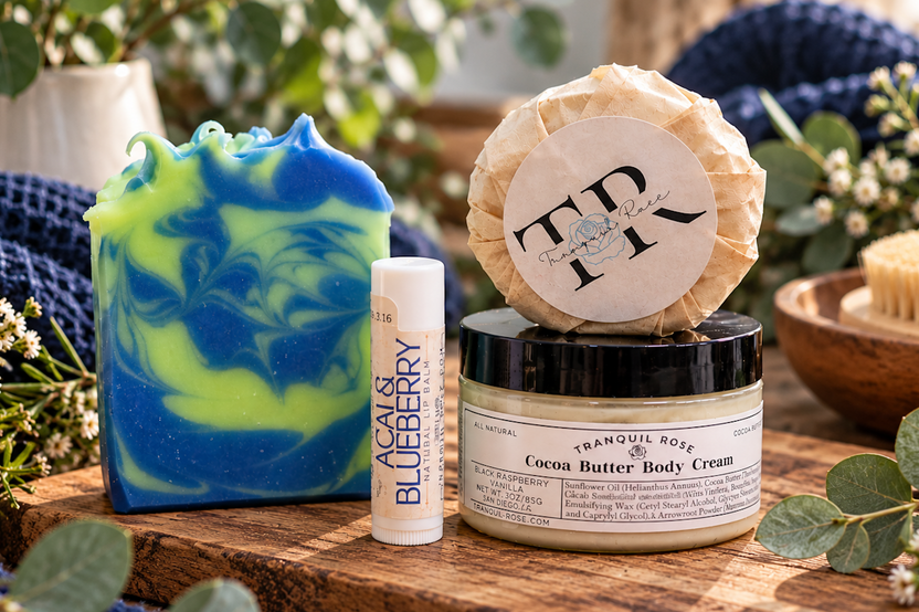 Handmade Acai and Blueberry soap bar with vibrant blue and green swirls beside natural skincare products