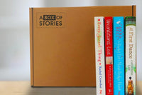 Brown box filled with fiction books, showcasing a variety of gripping titles and intriguing covers, perfect for mystery lovers.