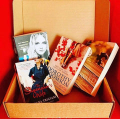 Brown subscription box filled with four young adult light reading books, featuring engaging stories and relatable characters for teen reader