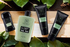 Very close up photo of 4 skin care and spa mens products from the bran Yard House. They are green and all only for males.