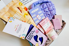 Colorful TEEN WISHBOX subscription box filled with skincare, socks, and snacks, ideal as a holiday gift for teens