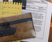 Close up photo of some papers that are included in the Breevello mystery escape game with some spy device included.