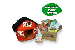 Barnyard Guinea Pig Pak featuring a large red barn hideout, Barnyard Treasure Box enrichment activity, Oxbow carrot and dill treats, natural