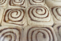 This image shows Cinnamon Rolls that have been baked using Risen Sourdough Starter Co.'s Starter. We added it to our baked goods !
