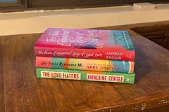 Three hardcover, contemporary romance titles by authors Hannah Brown, Abby Jimenez, and Katherine Center.