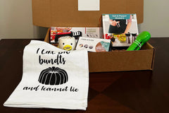 A subscription box full of different kitchen gadgets that are used for cooking, meal prep, or clean up.