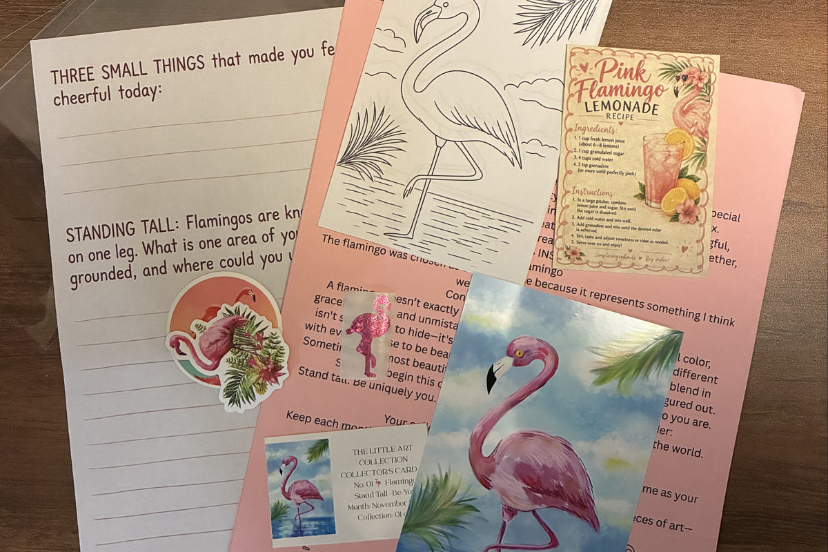 All pieces of the November flamingo happy mail envelope arranged in a flat lay: print, cards, letter, sticker and recipe card.