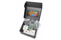 Open GemFlip gemstone box displaying natural rough stones and faceted gems in protective packaging, showcasing variety and quality for gemst