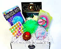 November Fidget Box
• Glow dinos
• Fliparoo
• Puffer ball
• LED ball
• Cotton candy slime
• White bubble pop
• Dino Fossil Putty