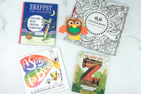 Owl Post Books kids book subscription box with holiday gift titles Snappsy the Alligator, A Season to Bee, and The Quest for Z.