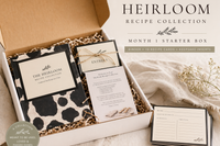 Unboxing of the Heirloom Recipe Collection featuring recipe binder, printed cards, and small kitchen extras in a warm, heirloom-style layout