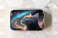 Outside label of one of the catnip tin variants. Featuring a cat gazing deeply into a galaxy filled sky.