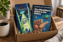 Douglas Adams' The Hitchhiker's Guide to the Galaxy hardcover with Beaned Up coffee in a sci-fi book subscription box