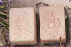 Handcrafted artisan soaps with embossed flower, butterfly, and dragonfly designs
Natural cold process soaps with botanical patterns for gent