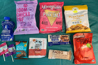 Sample box contents with Vegan Rob's, Beanfields, Crispy Fruit, Enjoy Life, Nature's Bakery and more.