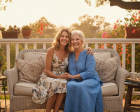 Daughter hugging her elderly mother after gifting a Senior Joy Box, a heartfelt subscription for senior women.