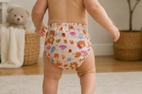 Baby walking wearing bear and fox cloth diaper
