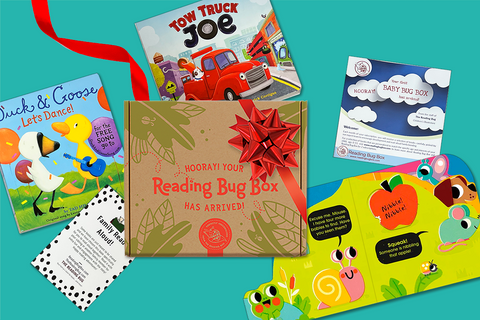 Colorful children's books featuring animals and vehicles with a Reading Bug Box subscription box for kids