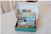 Box of Books subscription box featuring gardening and novel-themed items, including a gardening book and a customizable book subscription gift